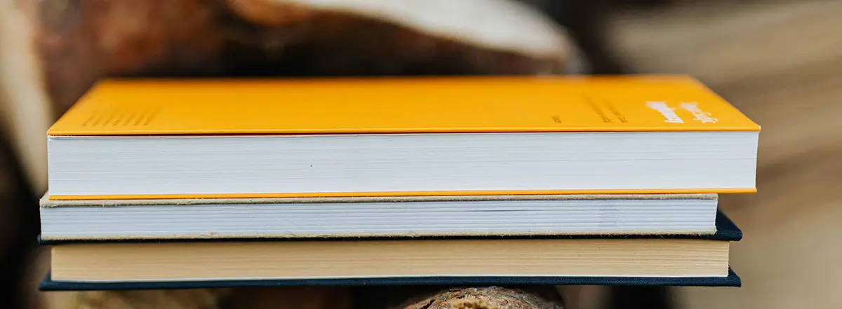 yellow book on a blue book at resources page.